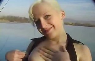 Blonde having sex by the river