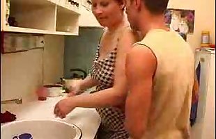mother washes dishes